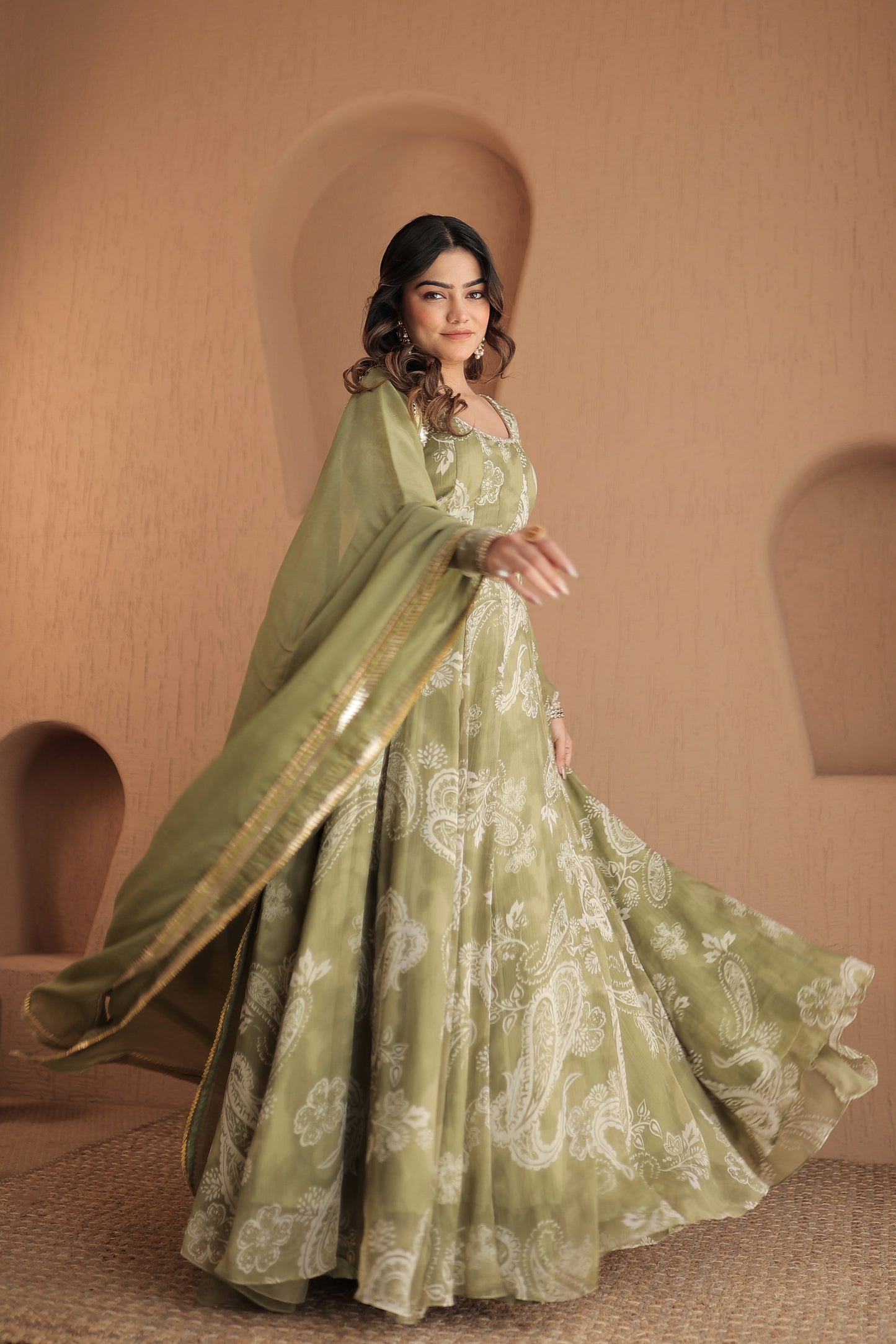 Rasiya green chiffon Anarkali dress by Imagine By Shiwali, showcasing intricate embroidery and flowing fabric.