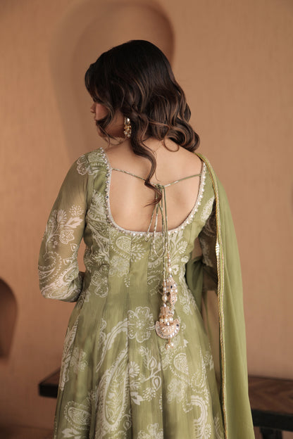 Green chiffon Rasiya anarkali dress by Imagine By Shiwali, showcasing intricate embroidery and flowing fabric.