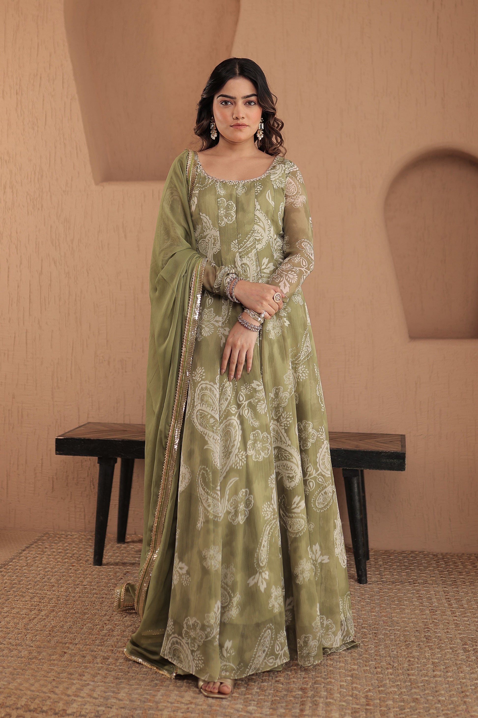 Rasiya green chiffon Anarkali dress by Imagine By Shiwali featuring intricate embroidery and flowing fabric.