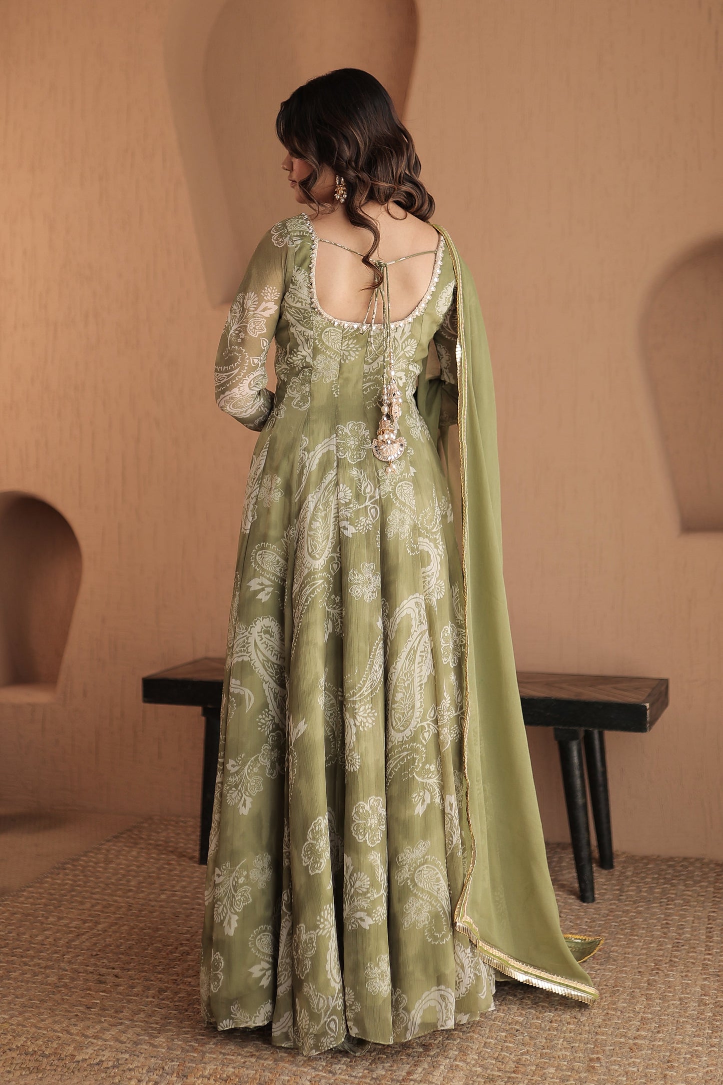 Green chiffon Rasiya anarkali dress by Imagine By Shiwali featuring intricate embroidery and flowing fabric.
