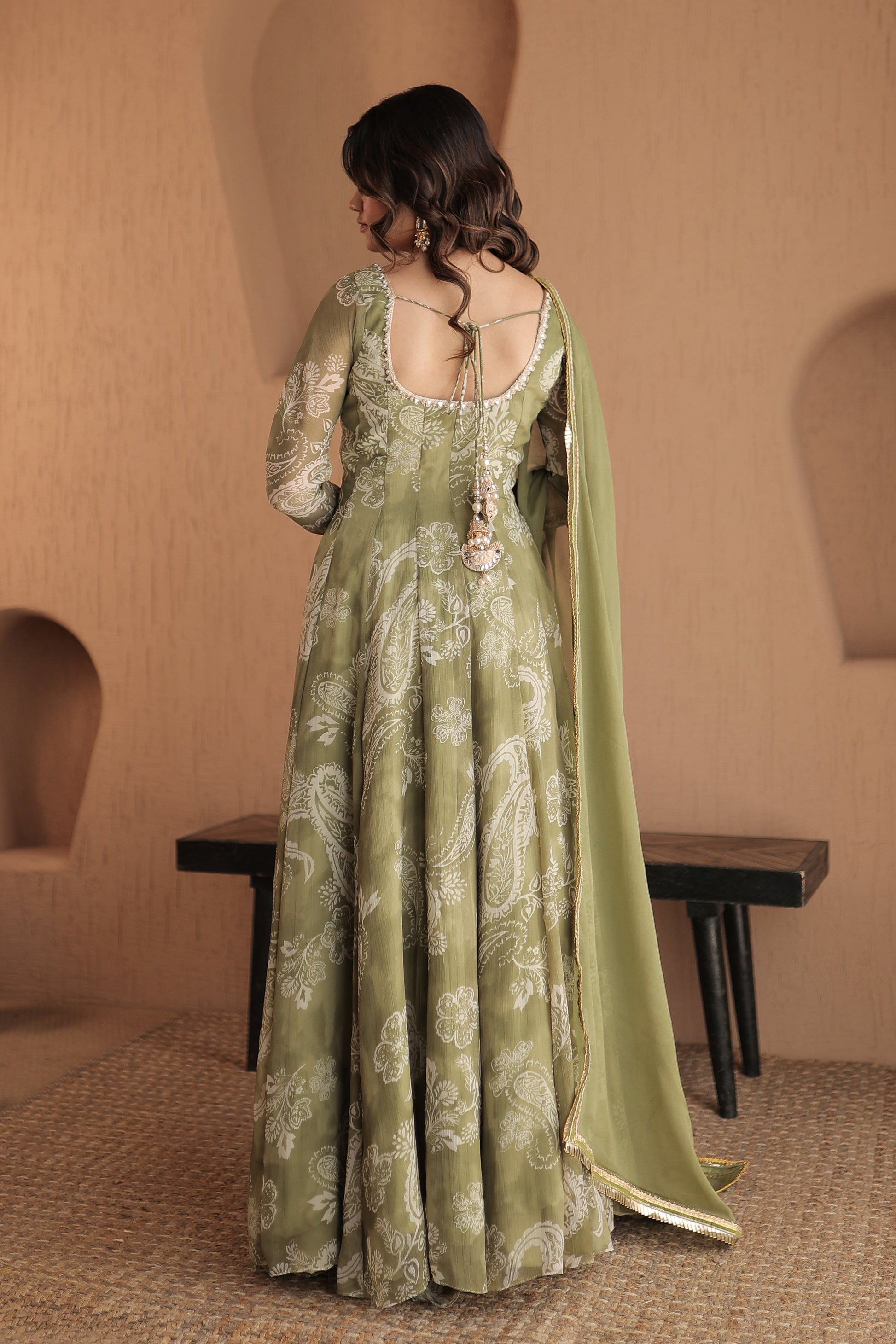 Green chiffon Rasiya anarkali dress by Imagine By Shiwali featuring intricate embroidery and flowing fabric.