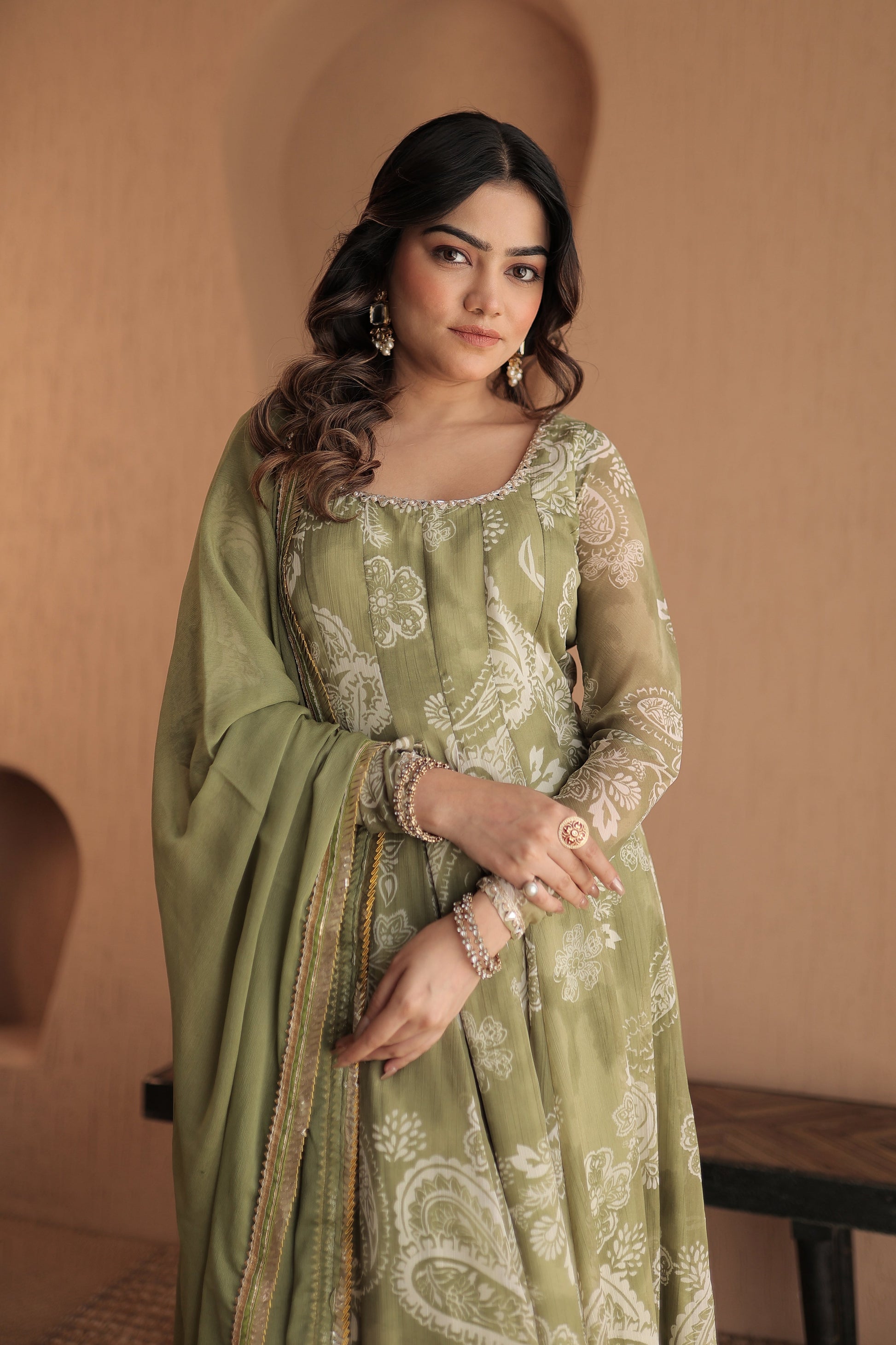 Green chiffon Rasiya Anarkali by Imagine By Shiwali, featuring intricate embroidery and flowing fabric.