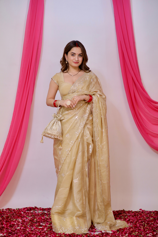 Golden Reva saree by Imagine By Shiwali featuring intricate embroidery and traditional design, draped elegantly.