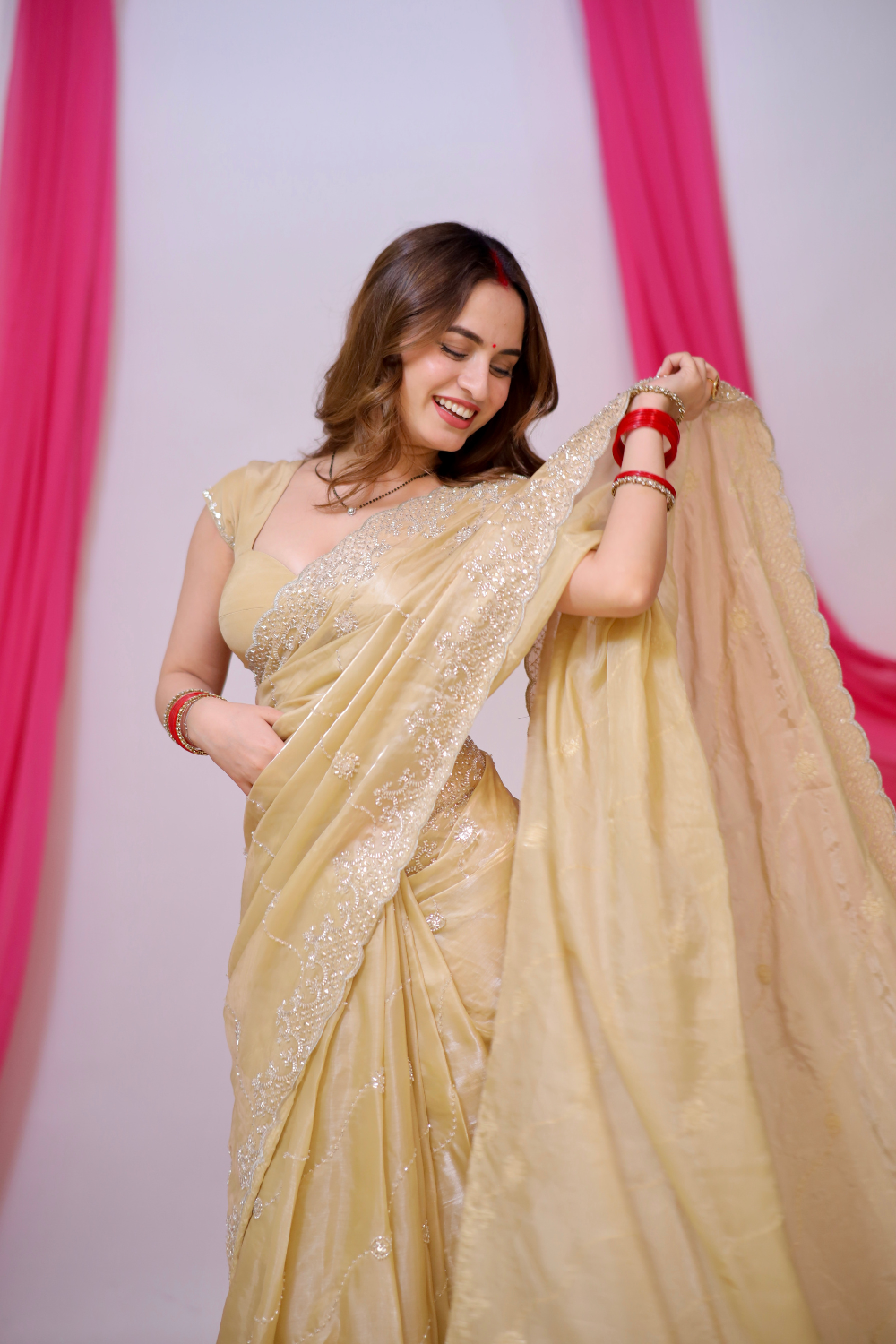 Gold Reva saree by Imagine By Shiwali featuring intricate patterns and elegant drape, perfect for festive occasions.