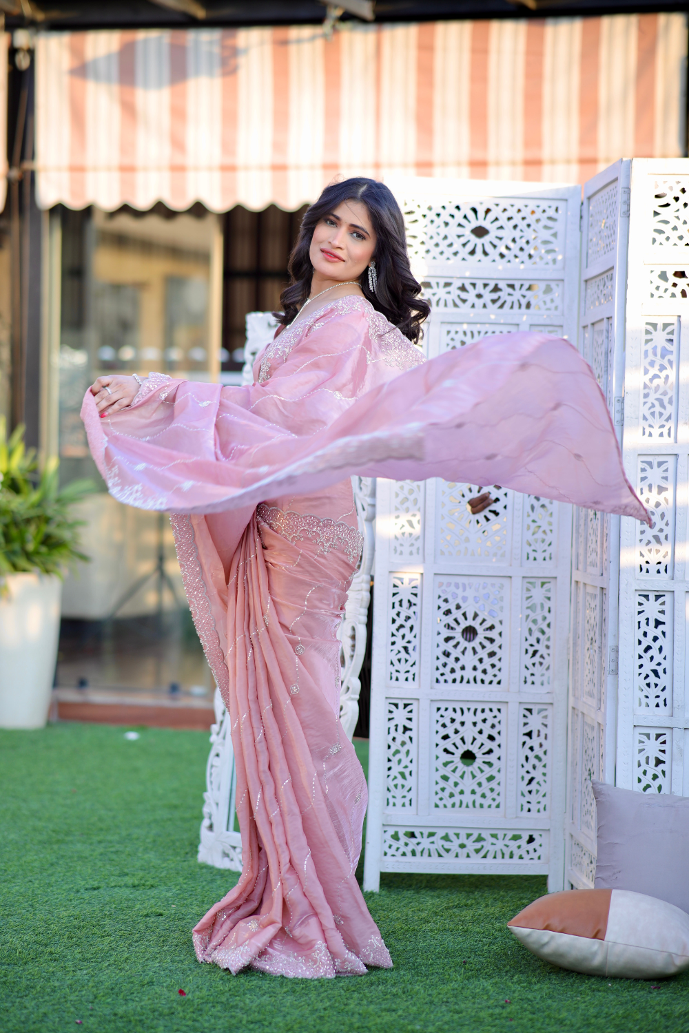 Pink pastel saree by Imagine By Shiwali, featuring elegant drape and intricate design details.