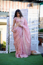 Pink pastel saree from Imagine By Shiwali's Reva collection, featuring elegant draping and traditional Indian craftsmanship.