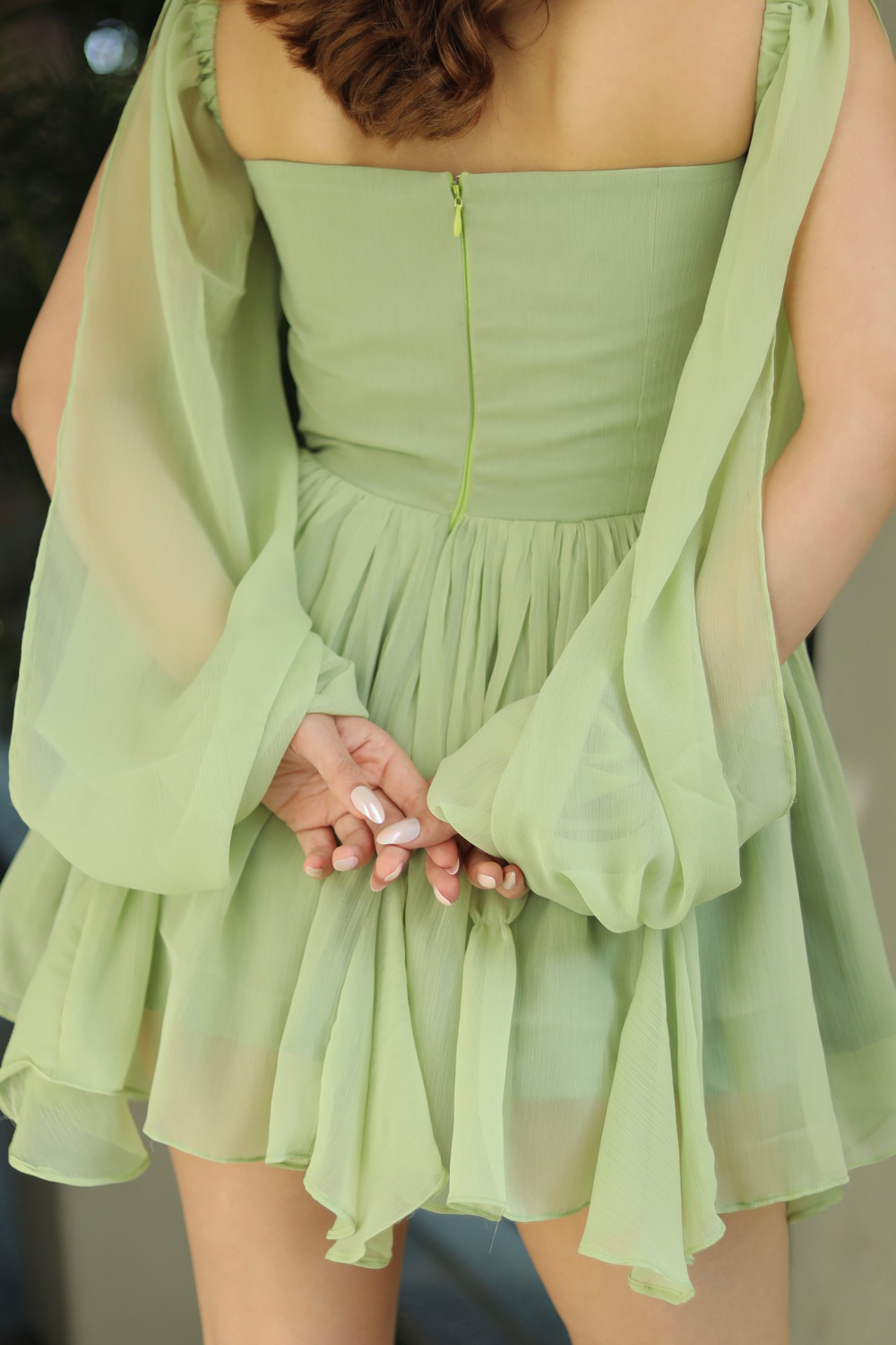 Imagine by Shiwali Rory green dress shown on a hanger, featuring a flowy fabric and stylish design for casual or semi-formal wear.