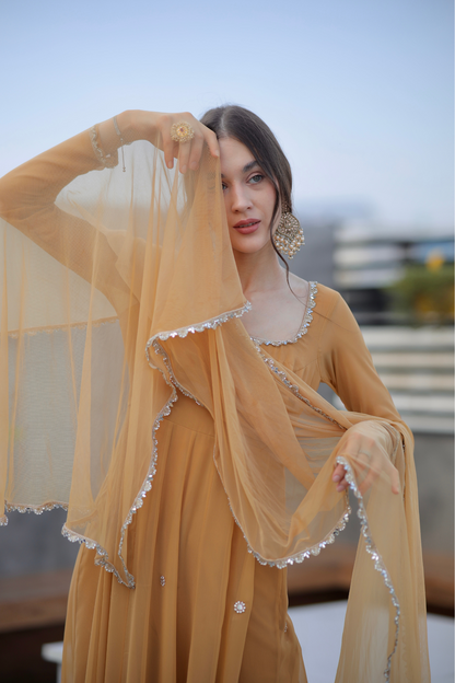 Brown Sharwari Anarkali dress by Imagine By Shiwali featuring intricate embroidery and flowing fabric.