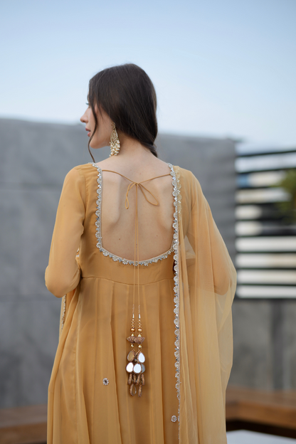 Brown Sharwari Anarkali dress by Imagine By Shiwali, featuring intricate embroidery and flowing fabric.