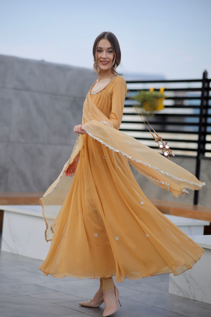 Brown Sharwari Anarkali dress by Imagine By Shiwali featuring intricate embroidery and flowing fabric.