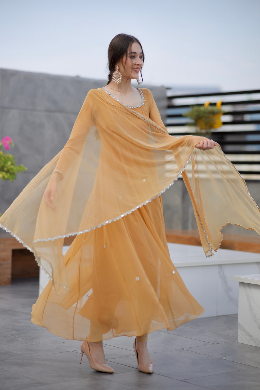 Brown Sharwari Anarkali dress by Imagine By Shiwali, featuring intricate embroidery and flowing fabric.