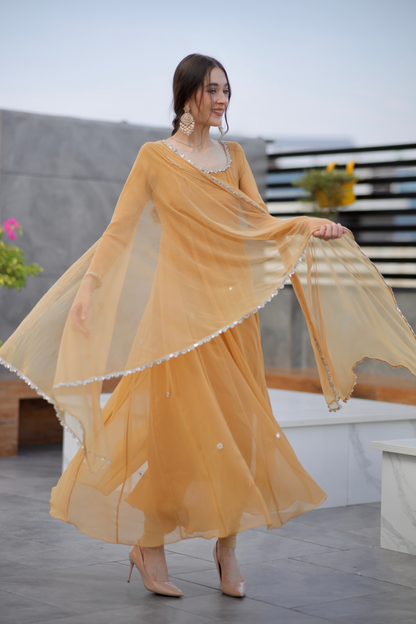 Brown Sharwari Anarkali dress by Imagine By Shiwali, featuring intricate embroidery and flowing fabric.