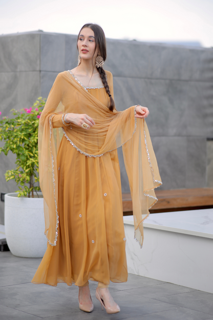 Brown Sharwari Anarkali dress by Imagine By Shiwali featuring intricate embroidery and flowing fabric.