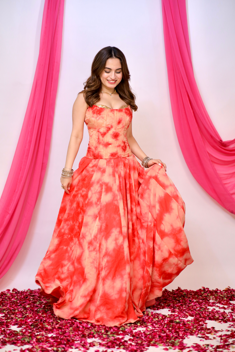 Beige and red Sia Tye-Dye Corset Lehnga Set by Imagine By Shiwali, with intricate embroidery and traditional design.