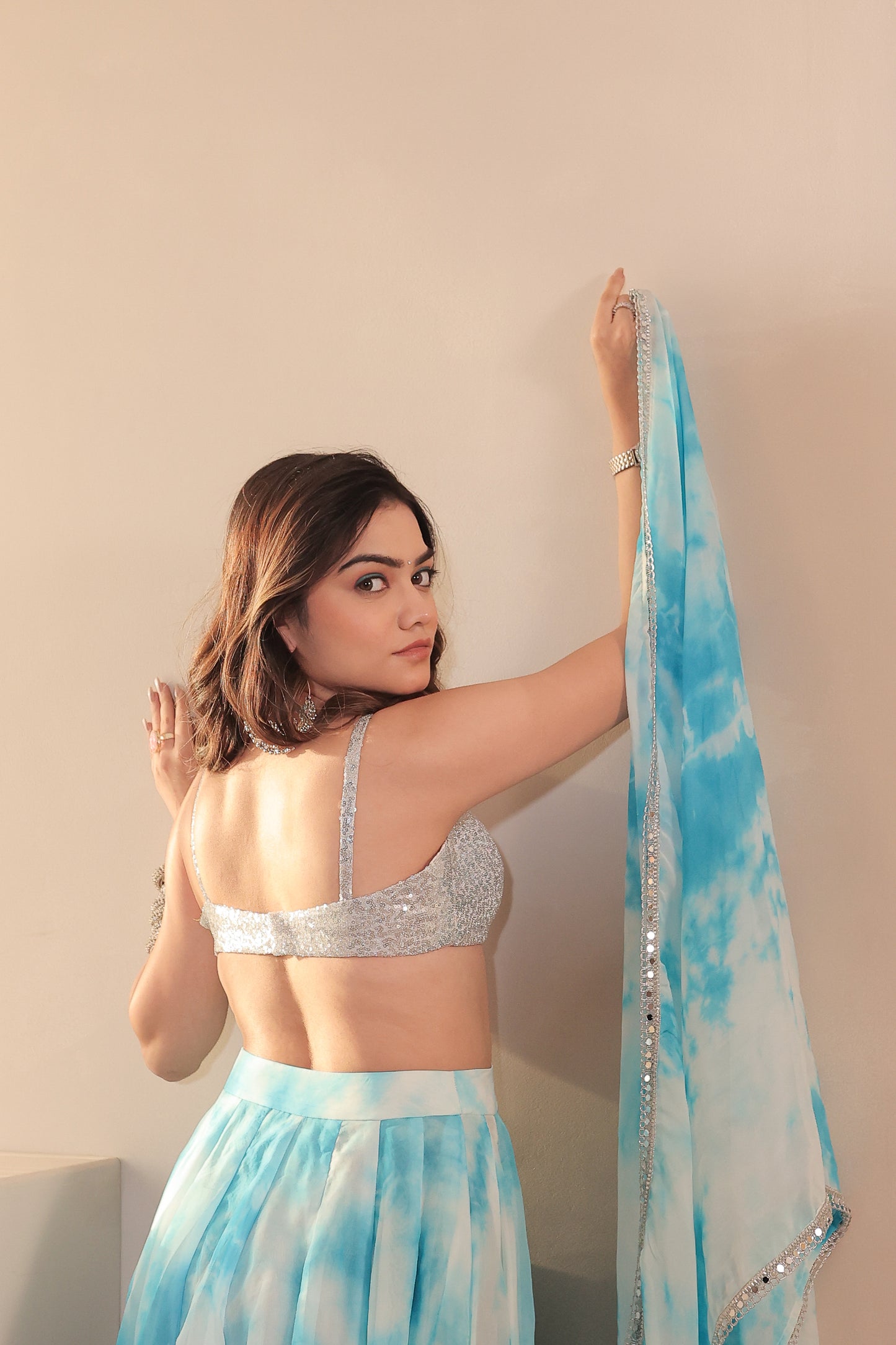 White and blue Sia Tye-Dye Lehnga Set by Imagine By Shiwali, featuring intricate patterns and traditional design.