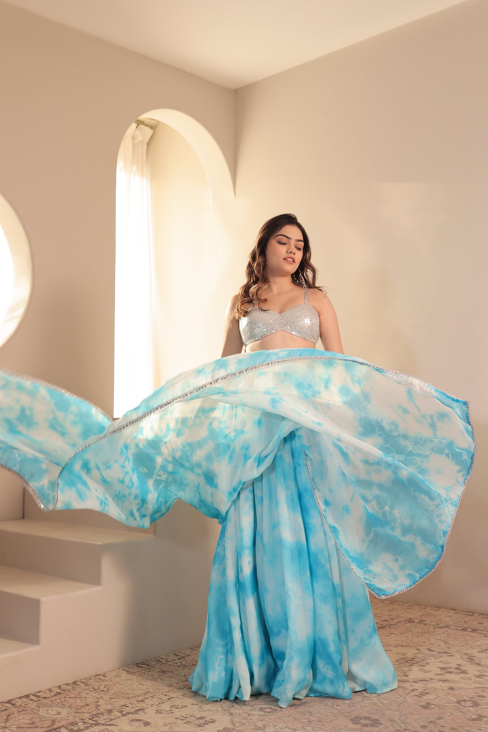 White and blue Sia Tye-Dye Lehnga Set by Imagine By Shiwali, featuring intricate tye-dye patterns and traditional Indian design.