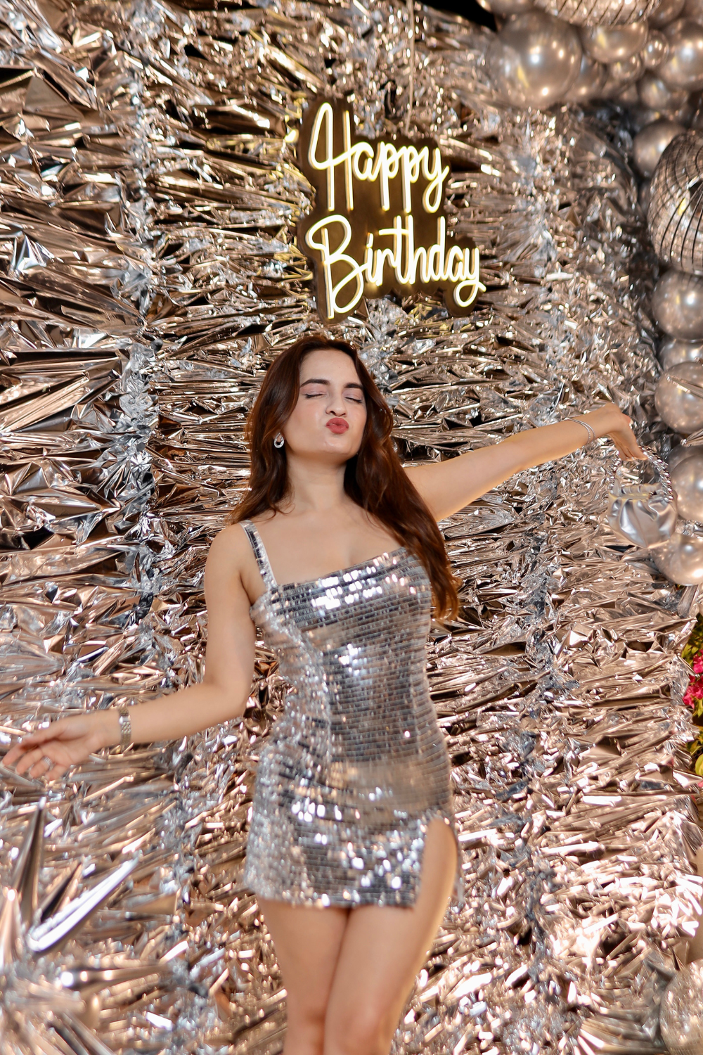 Sparkling silver bodycon dress by Imagine By Shiwali with a fitted silhouette and shimmering fabric.