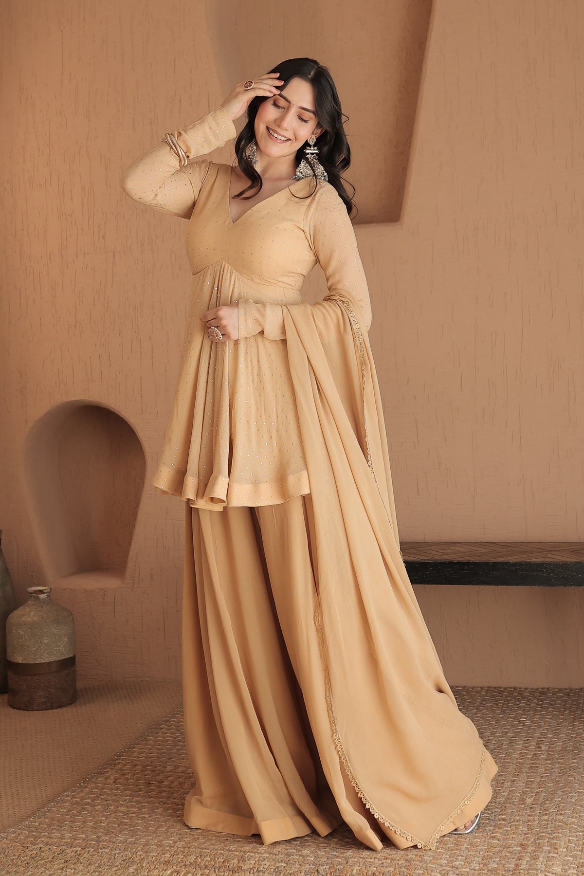 About Suraiya brown peplum suit