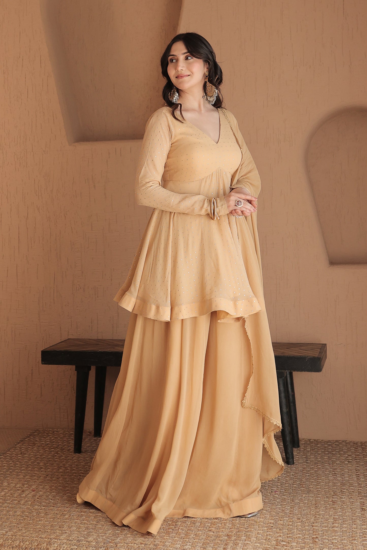 Brown Suraiya peplum suit by Imagine By Shiwali, featuring elegant traditional embroidery and a stylish peplum design.