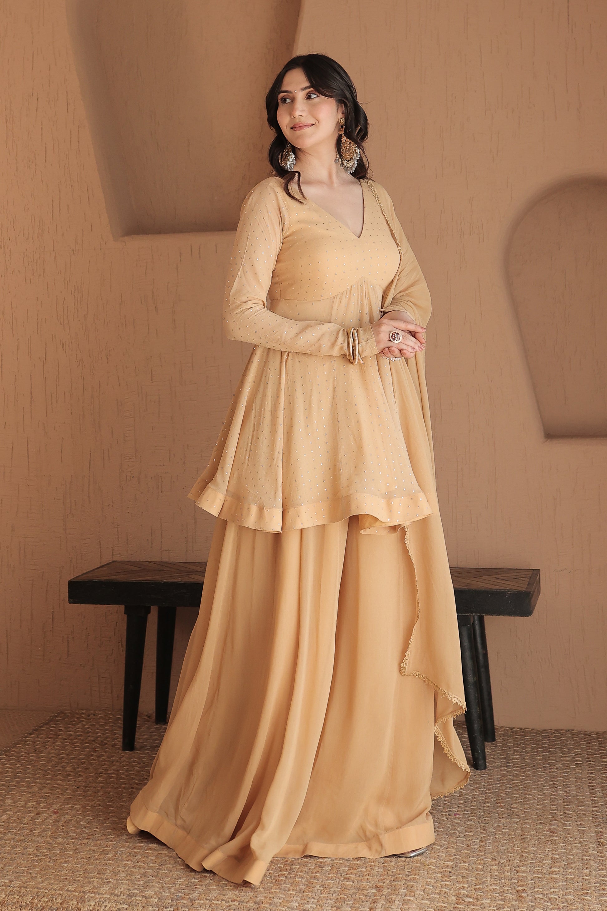 Brown Suraiya peplum suit by Imagine By Shiwali, featuring elegant traditional embroidery and a stylish peplum design.