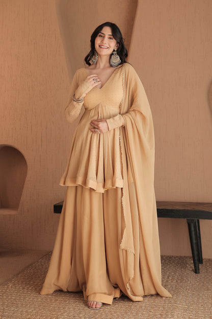 Brown Suraiya peplum suit by Imagine By Shiwali, detailed fabric with traditional embroidery and a flattering fit.