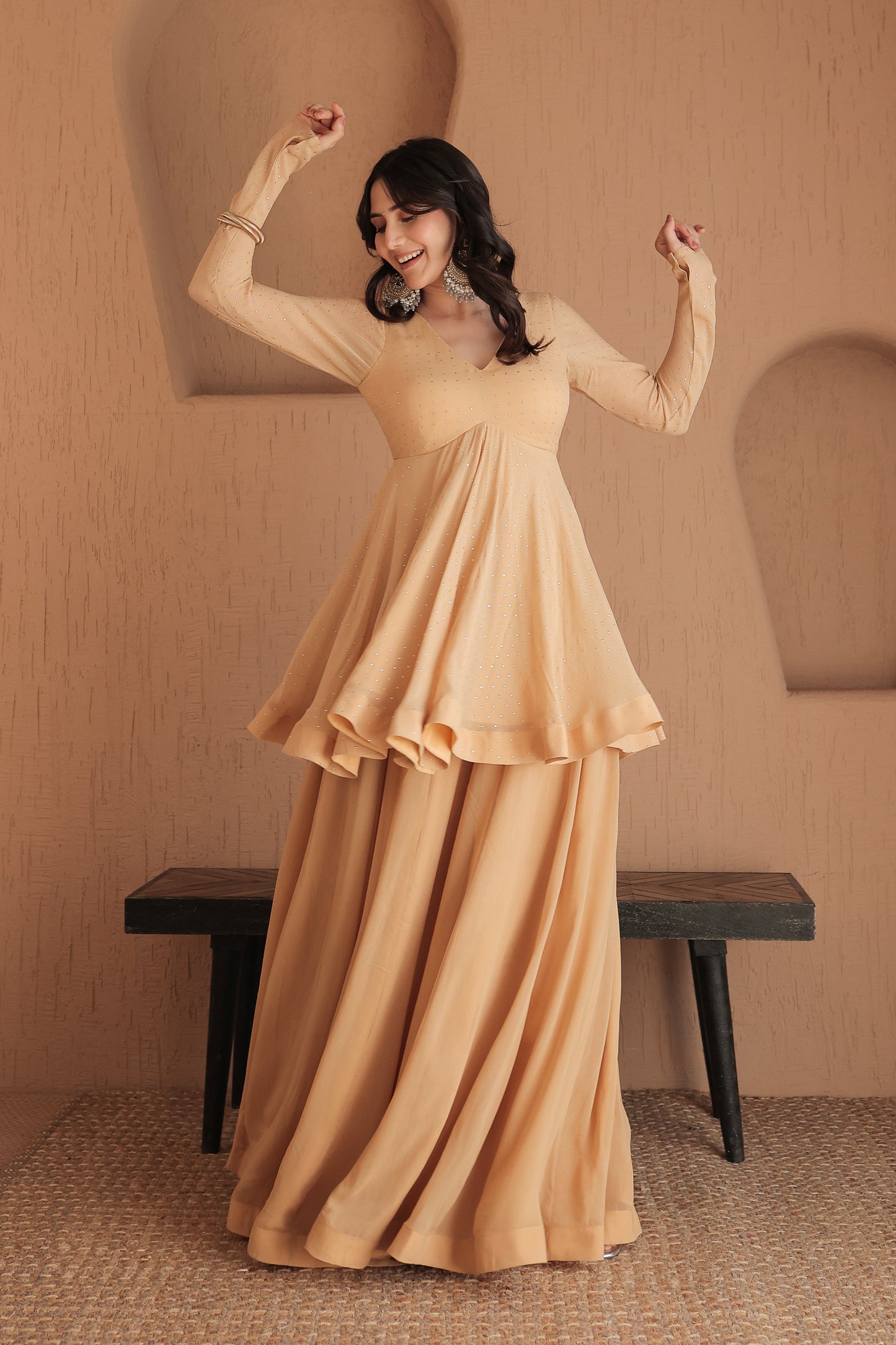 Brown Suraiya peplum suit by Imagine By Shiwali featuring intricate embroidery and a stylish peplum design.