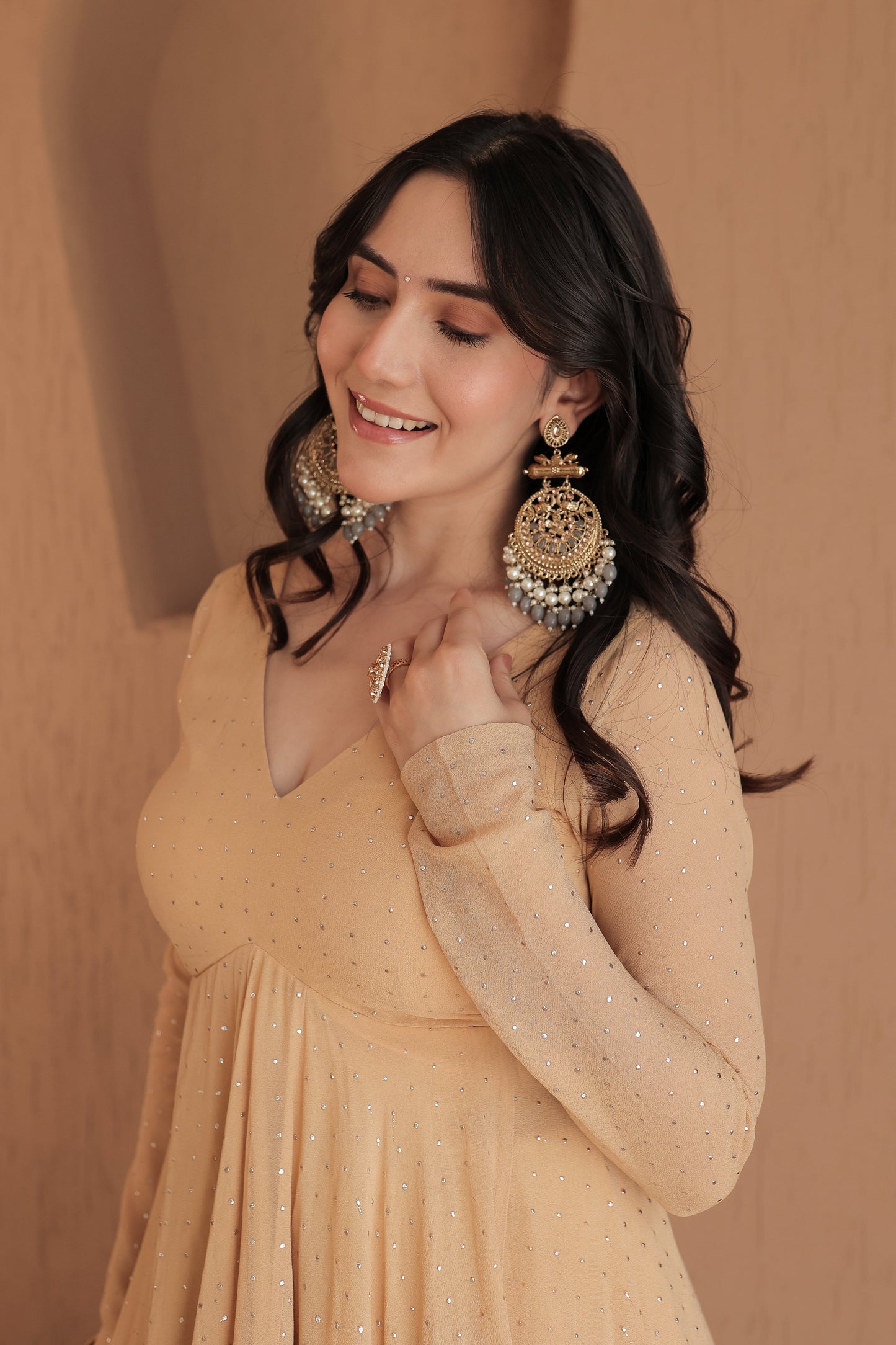 Brown Suraiya peplum suit by Imagine By Shiwali, featuring intricate embroidery and a stylish peplum design.