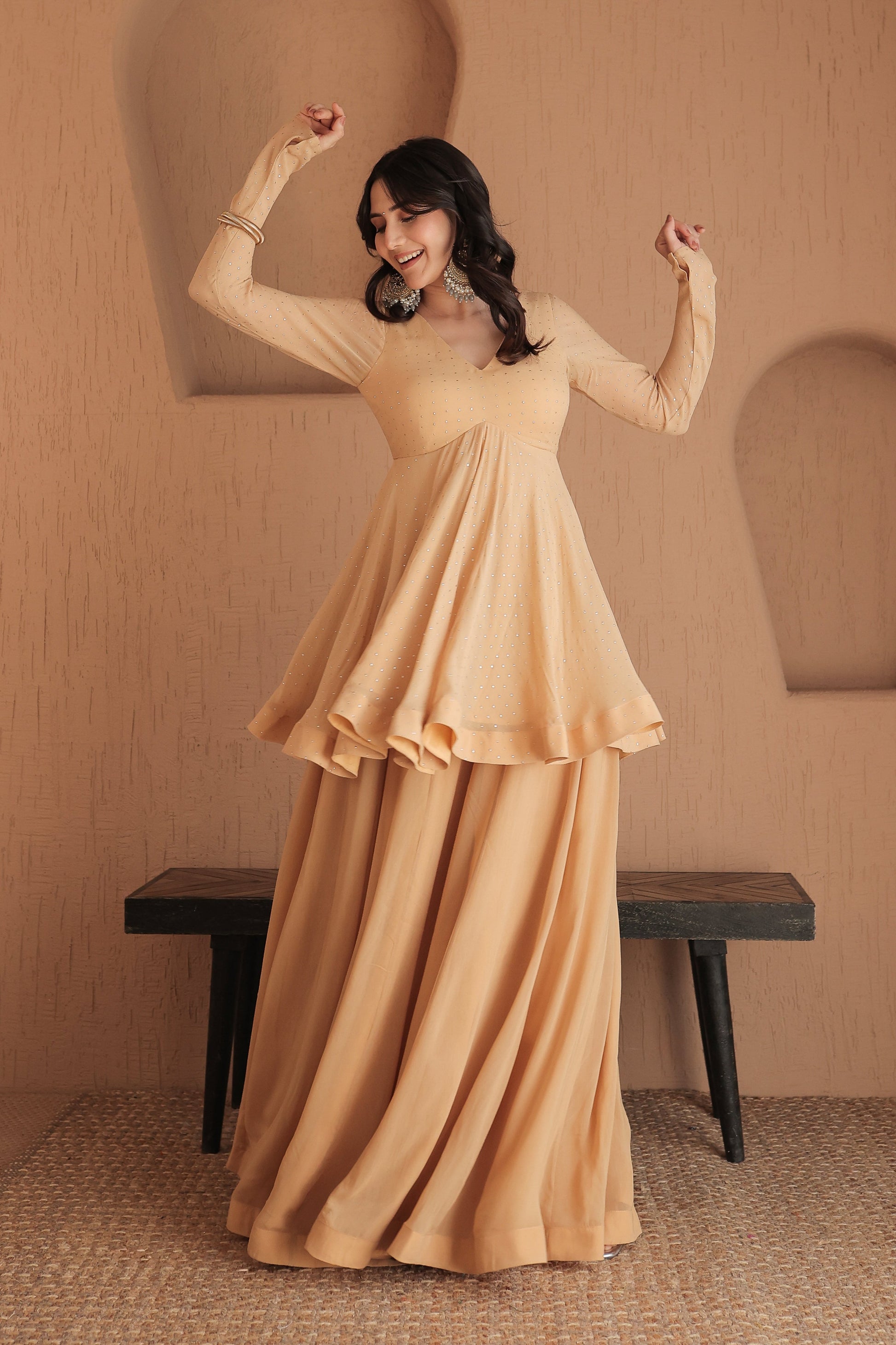 Brown Suraiya peplum suit by Imagine By Shiwali, featuring intricate embroidery and stylish peplum design, displayed on a mannequin.