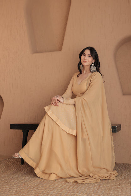 Brown Suraiya peplum suit by Imagine By Shiwali, featuring a stylish peplum top and matching traditional bottom.