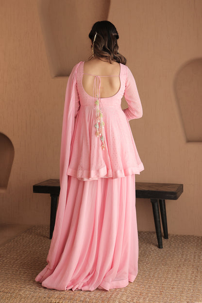 Pink Suraiya peplum suit by Imagine by Shiwali featuring intricate embroidery and a traditional silhouette.
