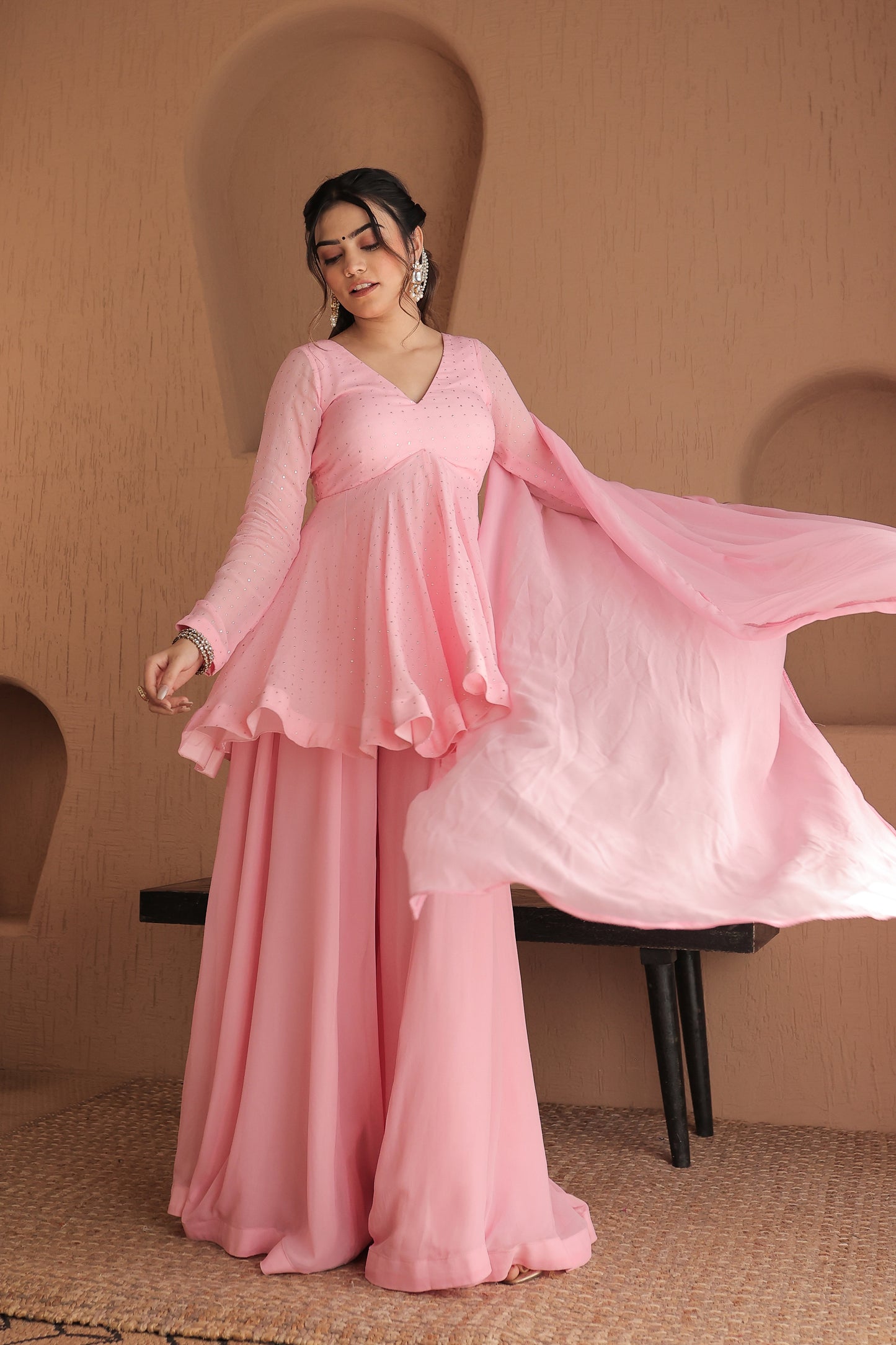 Pink Suraiya peplum suit by Imagine By Shiwali, featuring intricate embroidery and traditional design, displayed on a mannequin.