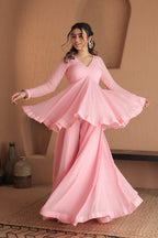 Pink Suraiya peplum suit by Imagine By Shiwali with intricate embroidery and flowing fabric for elegant traditional wear.