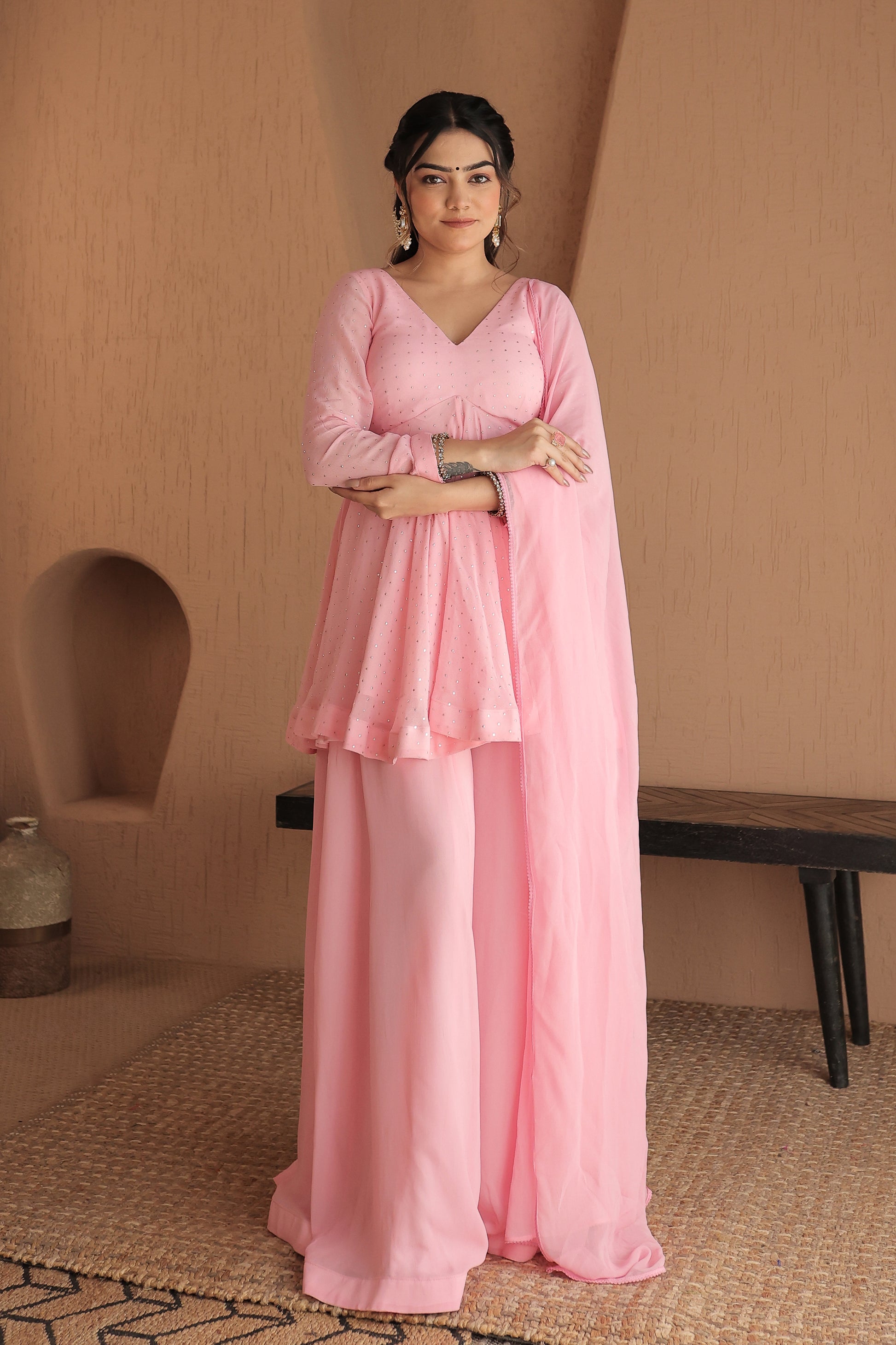 Pink Suraiya peplum suit by Imagine By Shiwali featuring intricate embroidery and a stylish, traditional design.