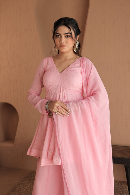 Pink Suraiya peplum suit by Imagine by Shiwali featuring intricate embroidery and a stylish, traditional design.