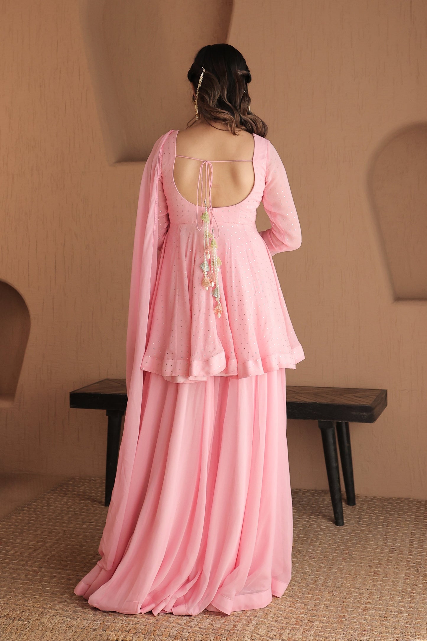 Pink Suraiya peplum suit by Imagine by Shiwali, showcasing intricate embroidery and a stylish traditional design.