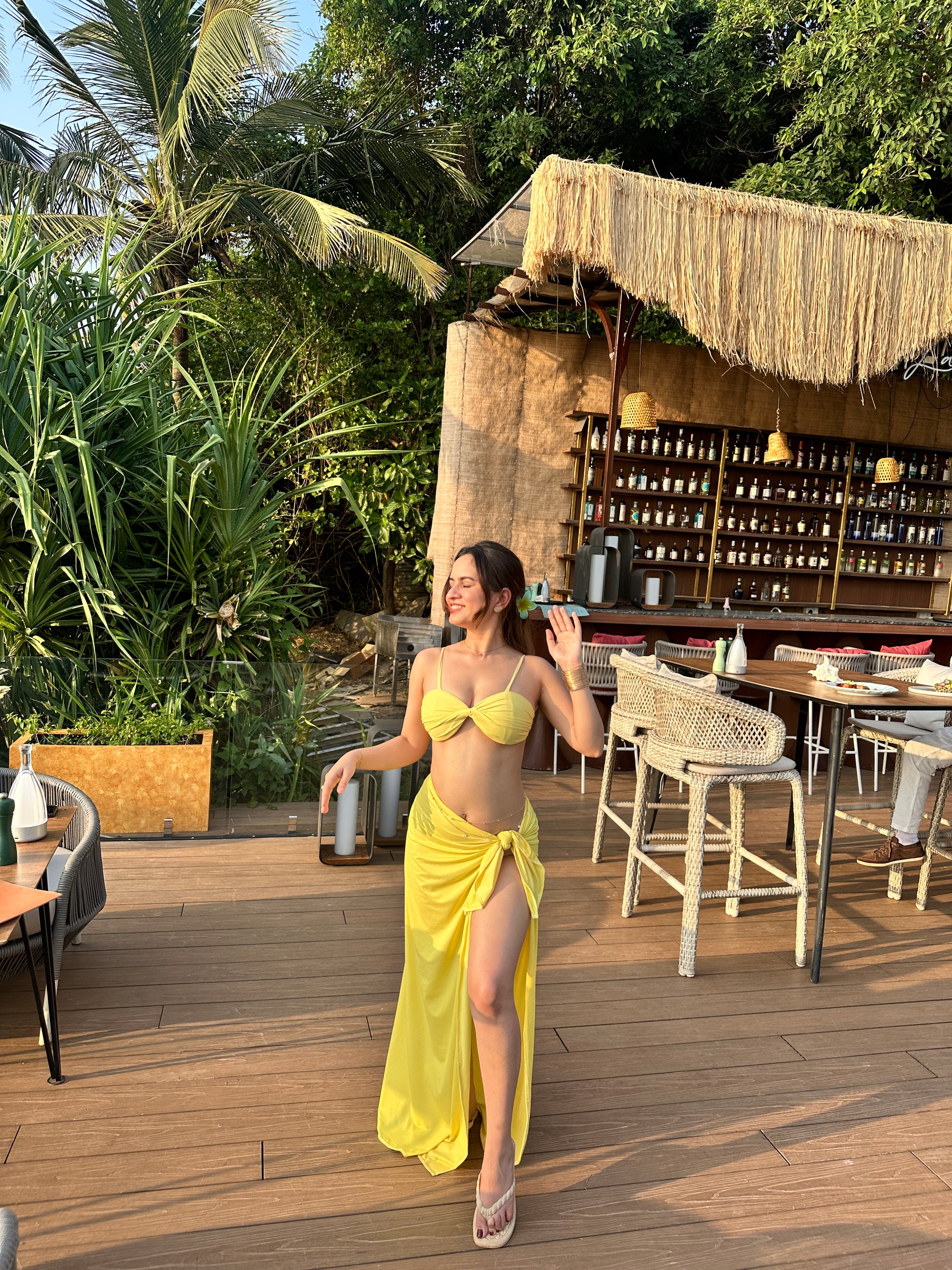 Yellow bikini with wrap skirt set by Imagine By Shiwali, featuring a stylish two-piece swimwear look with vibrant color.