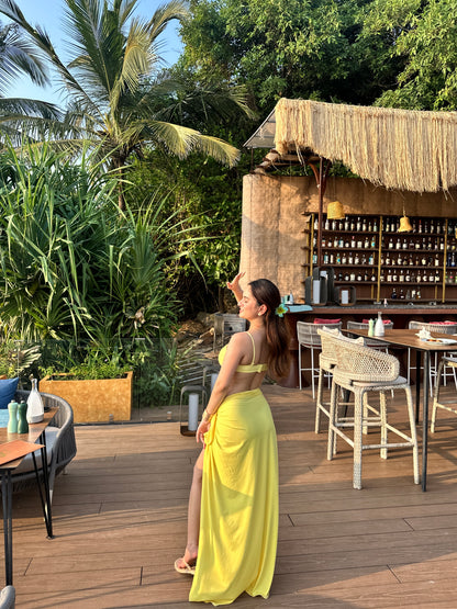 Sussie yellow bikini with wrap skirt set by Imagine By Shiwali, featuring a bright yellow bikini top and matching skirt for beachwear.