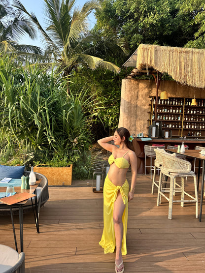 Yellow bikini with wrap skirt set from Imagine By Shiwali, featuring a stylish two-piece swimwear design.