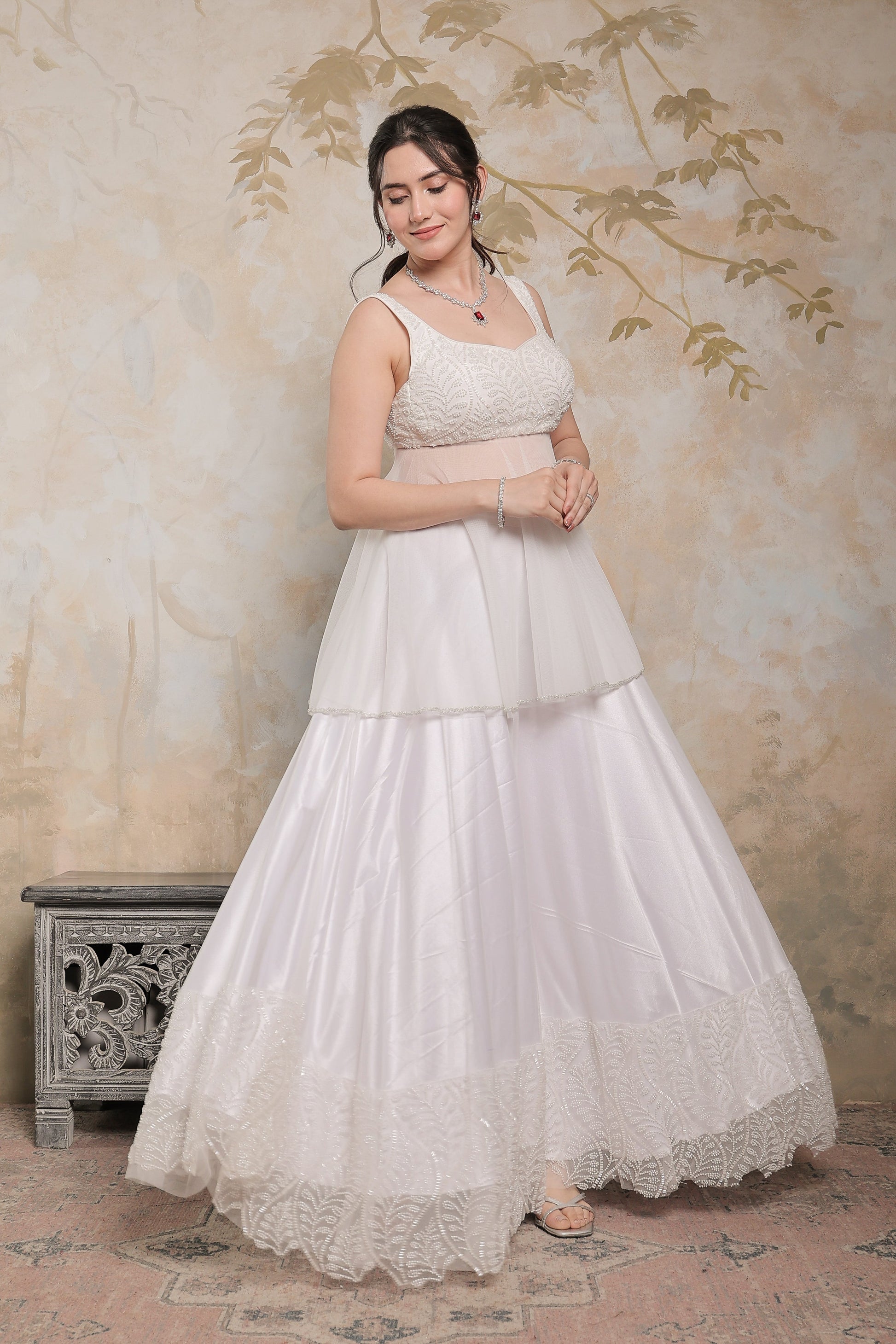 Imagine By Shiwali Vaara White Peplum Lehnga with intricate embroidery and flowy fabric, perfect for festive occasions.